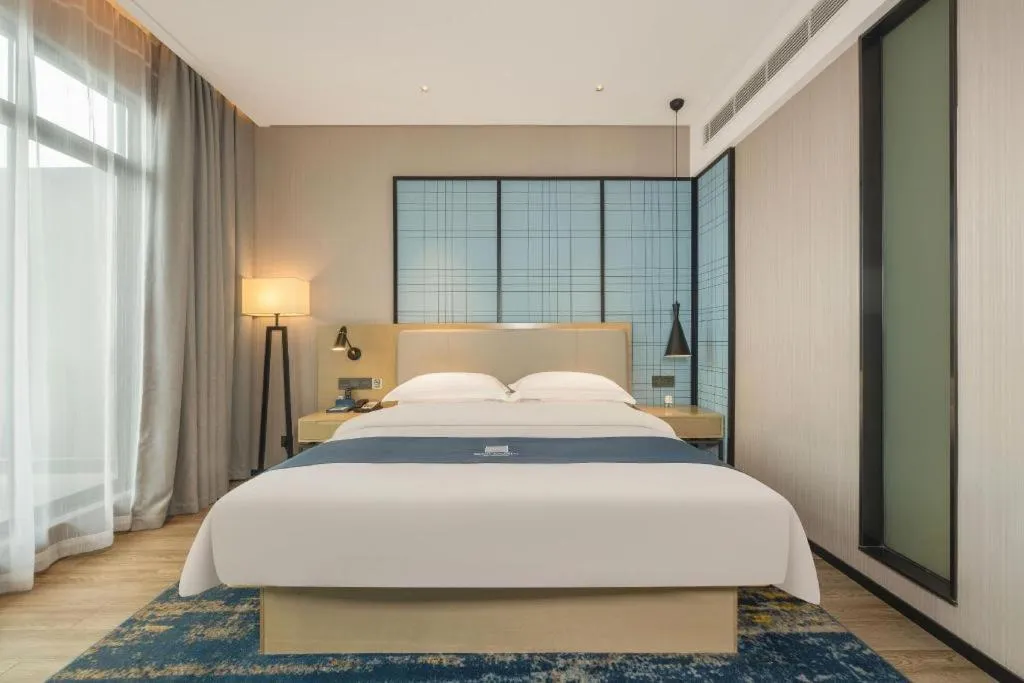 Bed in Echarm Hotel Fangchenggang Qisha