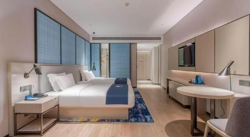 Bed in Echarm Hotel Fangchenggang Qisha