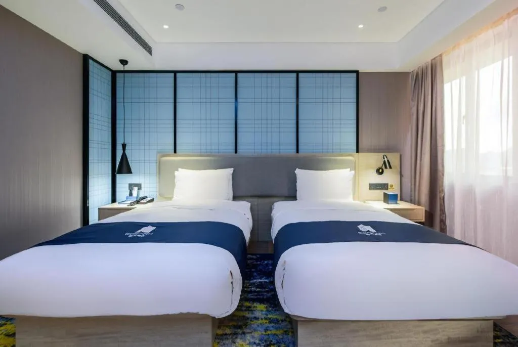 Bed in Echarm Hotel Fangchenggang Qisha