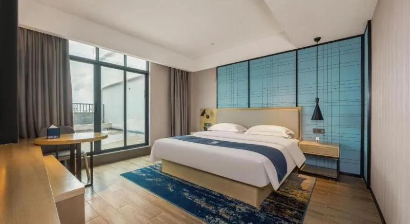 Bed in Echarm Hotel Fangchenggang Qisha