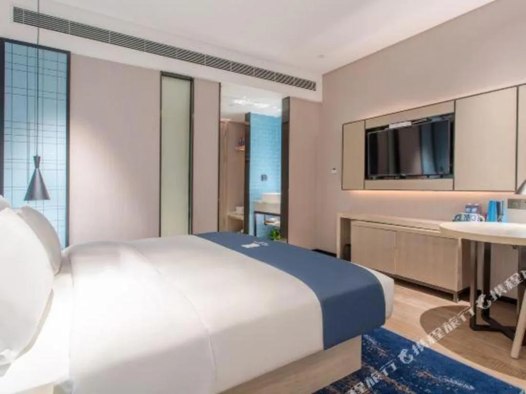 Bed in Echarm Hotel Fangchenggang Qisha