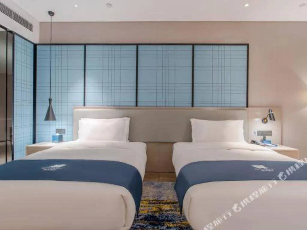 Bed in Echarm Hotel Fangchenggang Qisha