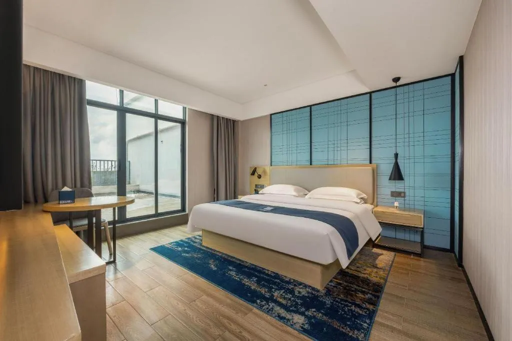 Bed in Echarm Hotel Fangchenggang Qisha