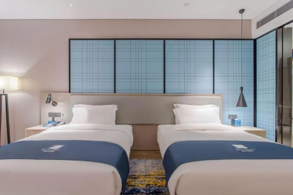 Bed in Echarm Hotel Fangchenggang Qisha