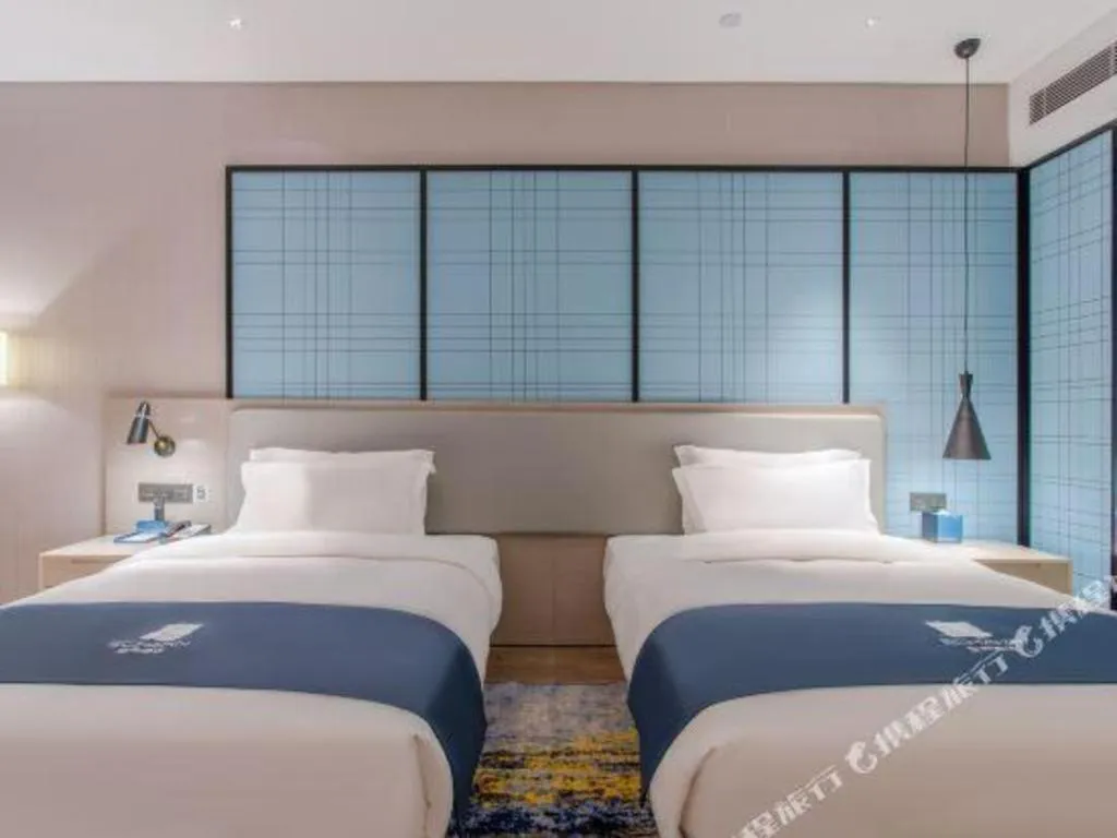 Bed in Echarm Hotel Fangchenggang Qisha