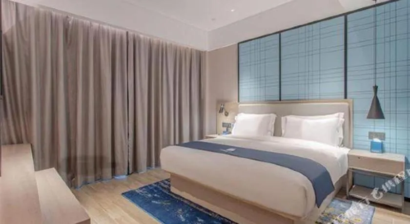 Bed in Echarm Hotel Fangchenggang Qisha