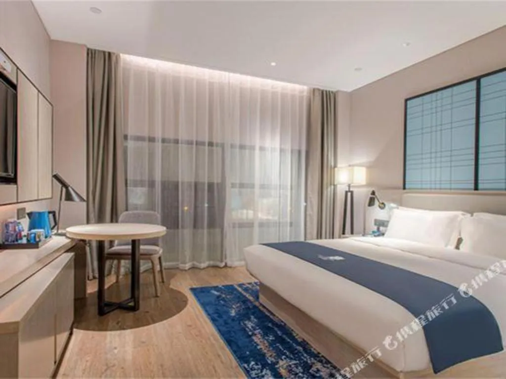 Bed in Echarm Hotel Fangchenggang Qisha