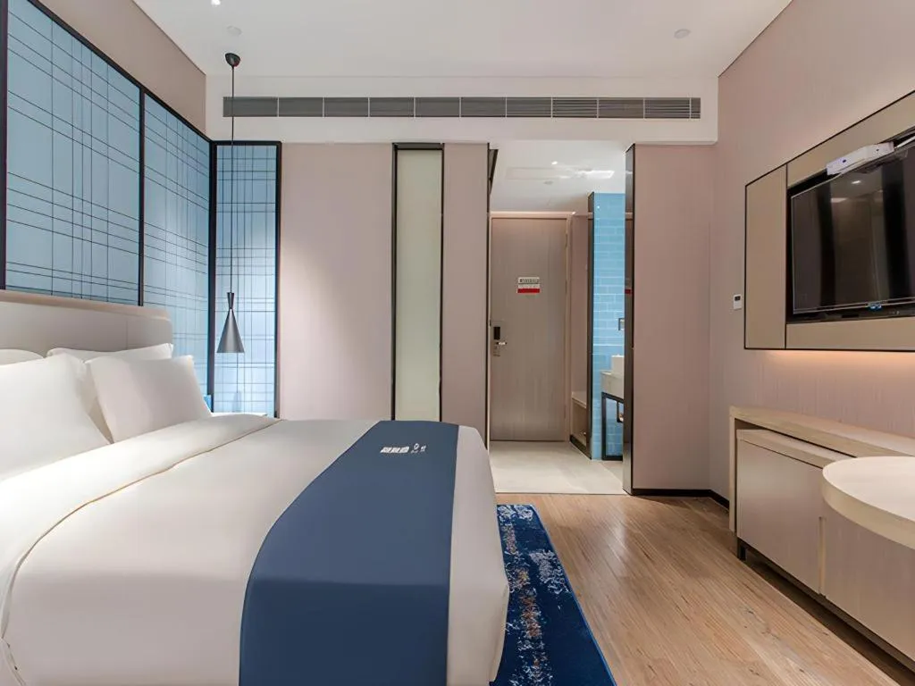 Bed in Echarm Hotel Fangchenggang Qisha