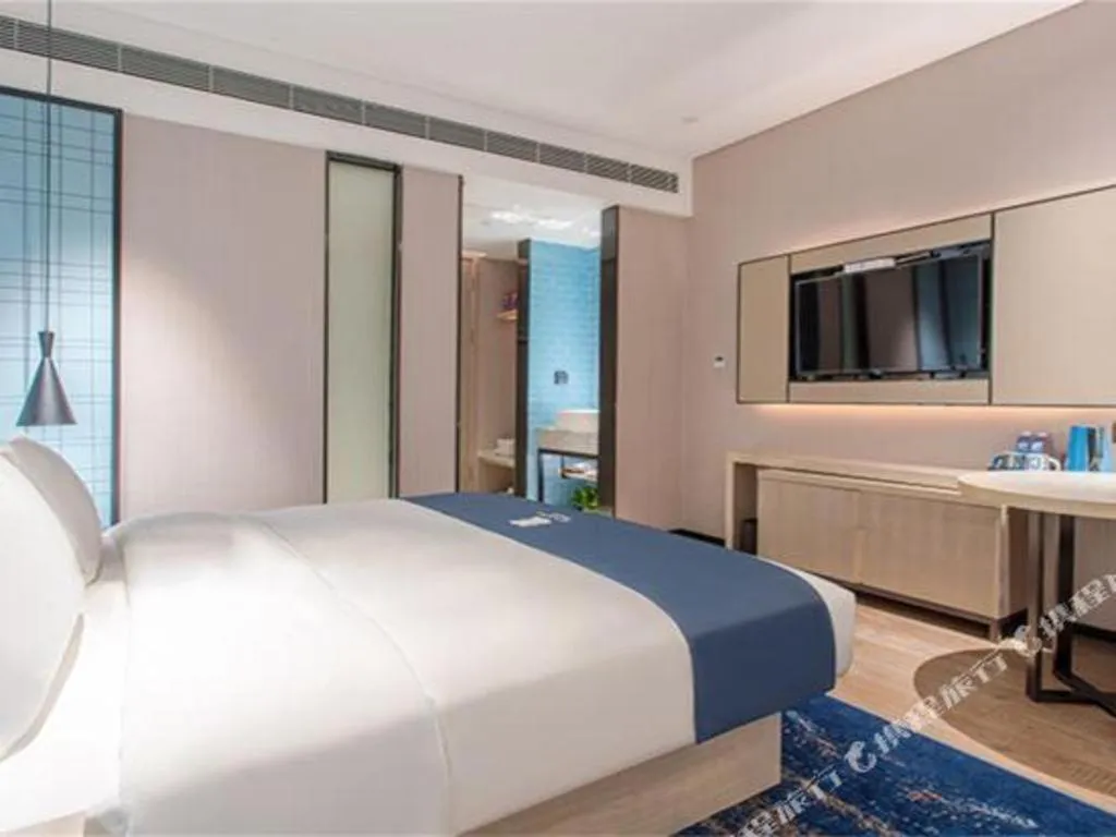 Bed in Echarm Hotel Fangchenggang Qisha