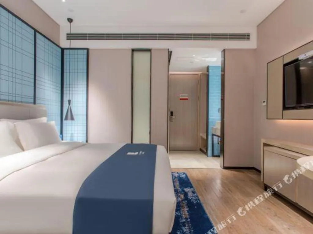 Bed in Echarm Hotel Fangchenggang Qisha