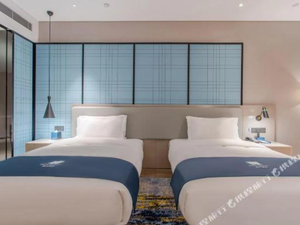 Bed in Echarm Hotel Fangchenggang Qisha