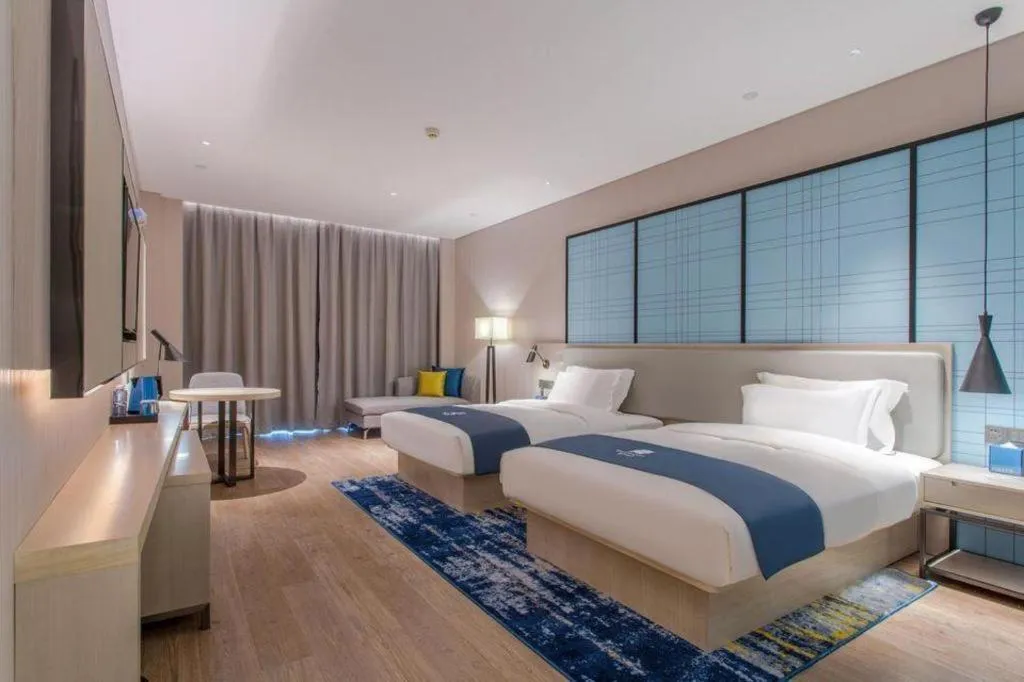 Bed in Echarm Hotel Fangchenggang Qisha