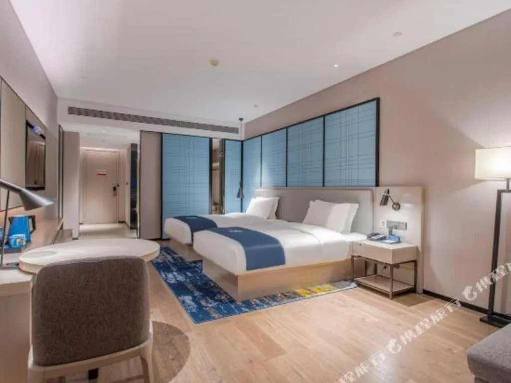 Bed in Echarm Hotel Fangchenggang Qisha