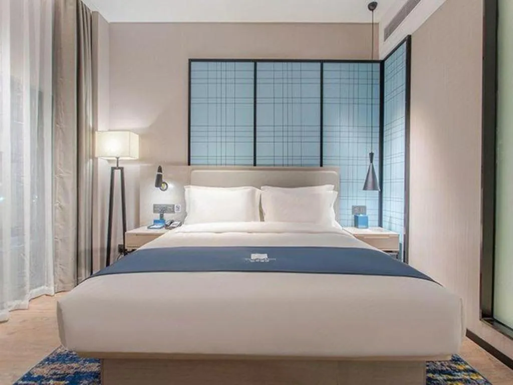 Bed in Echarm Hotel Fangchenggang Qisha