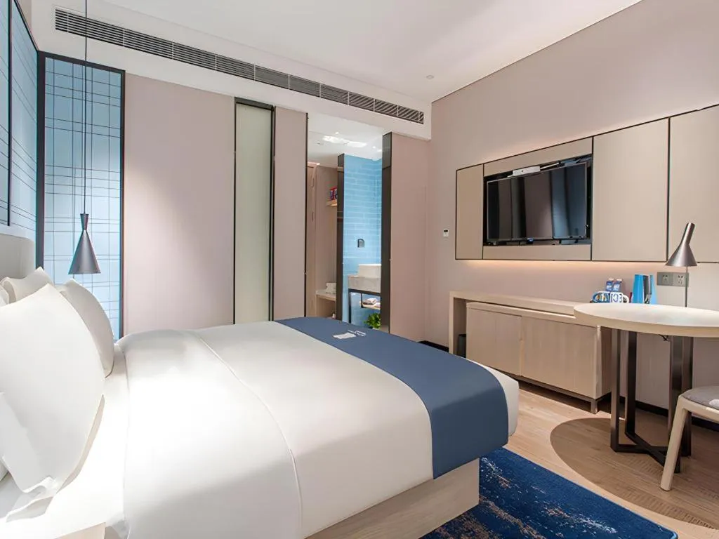 Bed in Echarm Hotel Fangchenggang Qisha