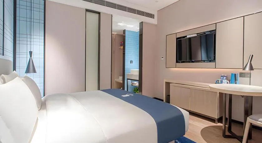 Bed in Echarm Hotel Fangchenggang Qisha