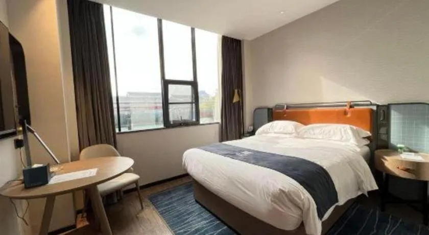 Bed in Echarm Hotel Liuzhou Yaobu Ancient Town