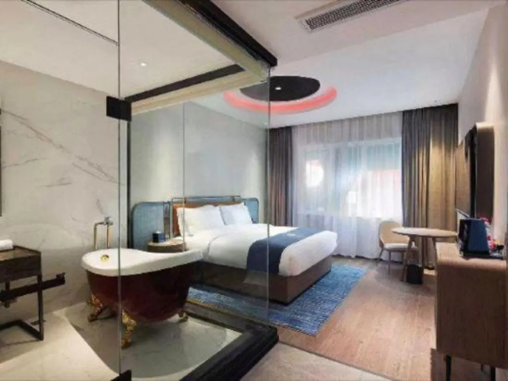 Bed in Echarm Hotel Liuzhou Yaobu Ancient Town