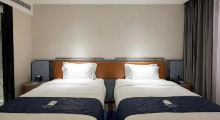 Bed in Echarm Hotel Liuzhou Yaobu Ancient Town