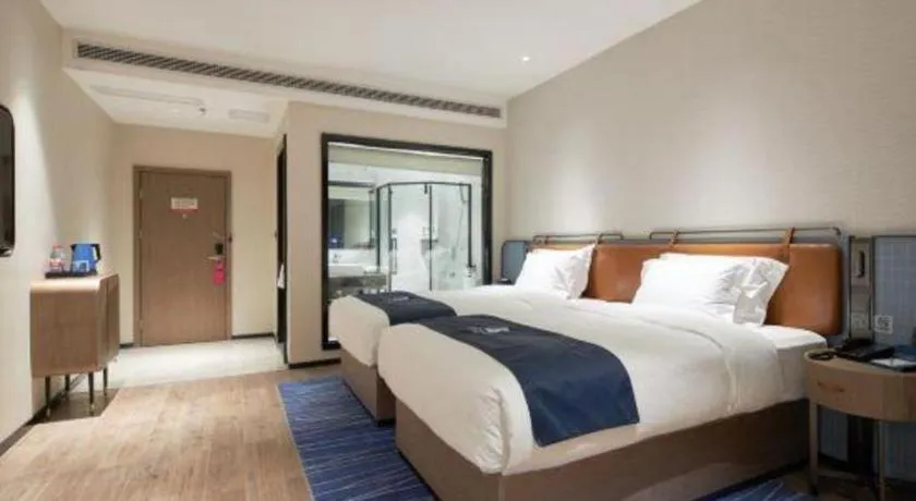 Bed in Echarm Hotel Liuzhou Yaobu Ancient Town