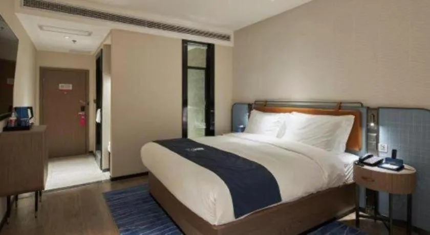 Bed in Echarm Hotel Liuzhou Yaobu Ancient Town