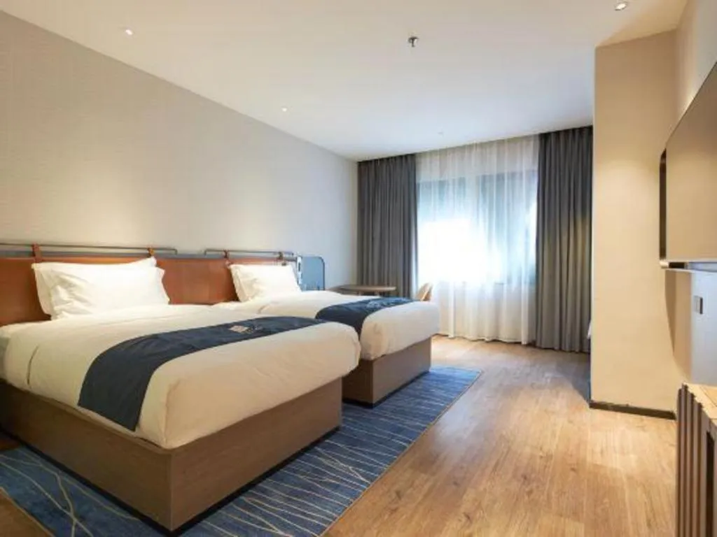 Bed in Echarm Hotel Liuzhou Yaobu Ancient Town