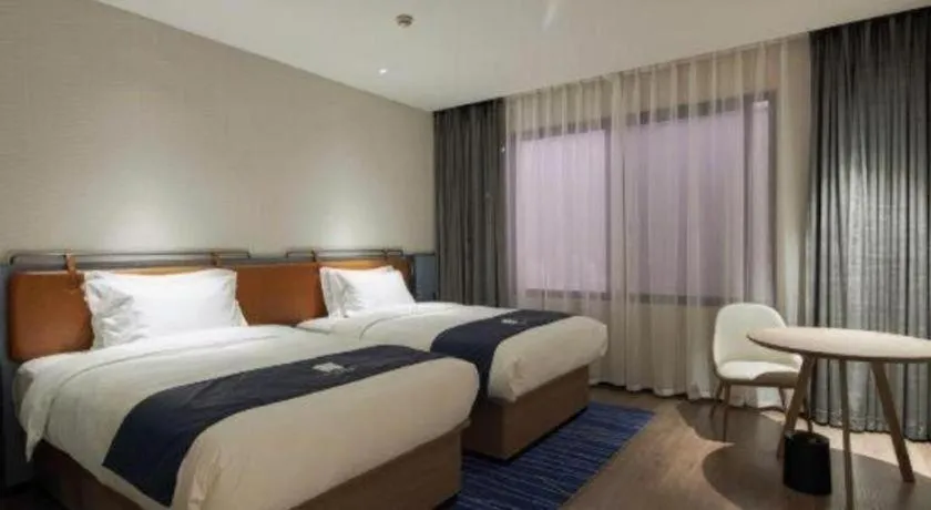 Bed in Echarm Hotel Liuzhou Yaobu Ancient Town