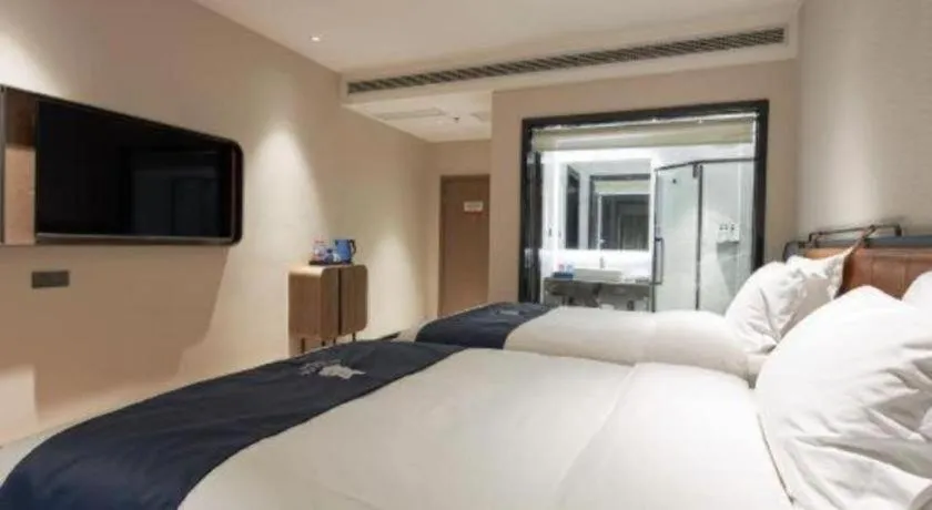 Bed in Echarm Hotel Liuzhou Yaobu Ancient Town