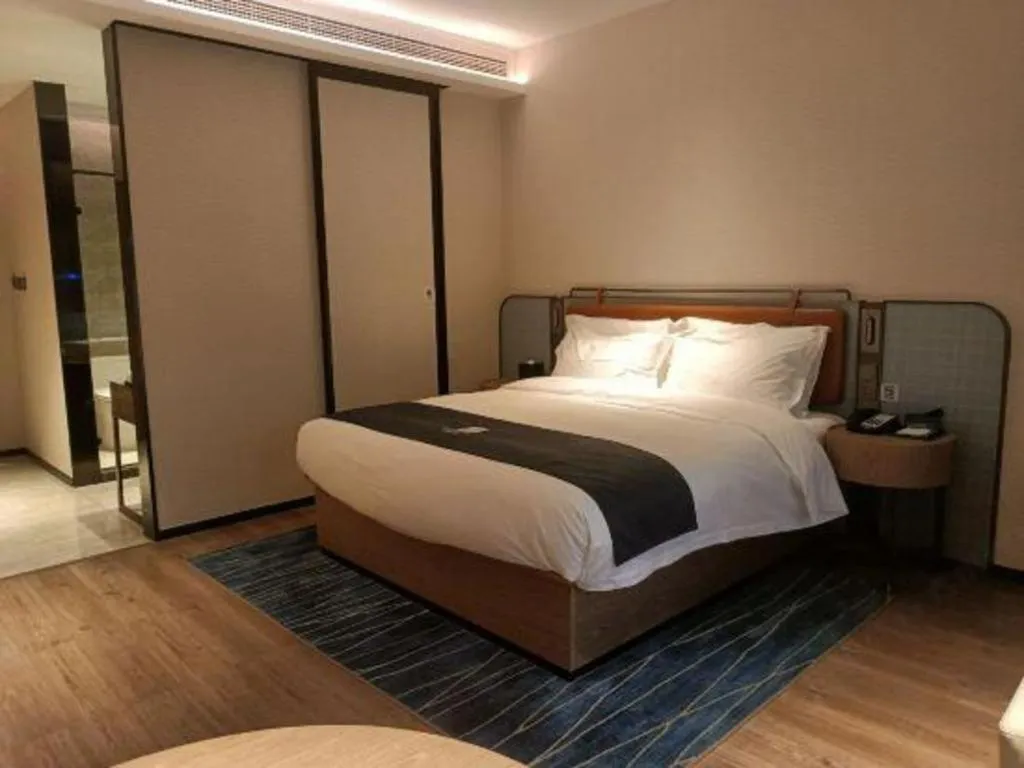 Bed in Echarm Hotel Liuzhou Yaobu Ancient Town