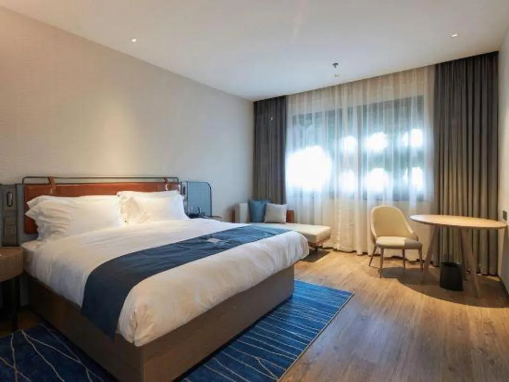 Bed in Echarm Hotel Liuzhou Yaobu Ancient Town