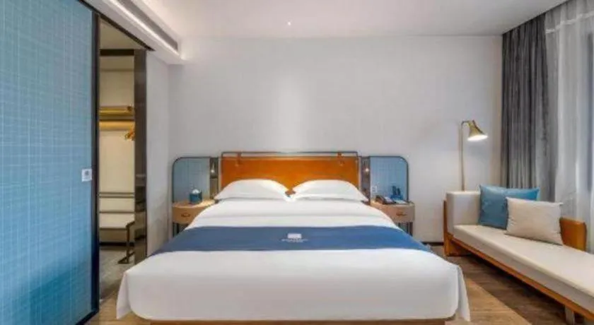 Bed in Echarm Hotel Liuzhou Yaobu Ancient Town
