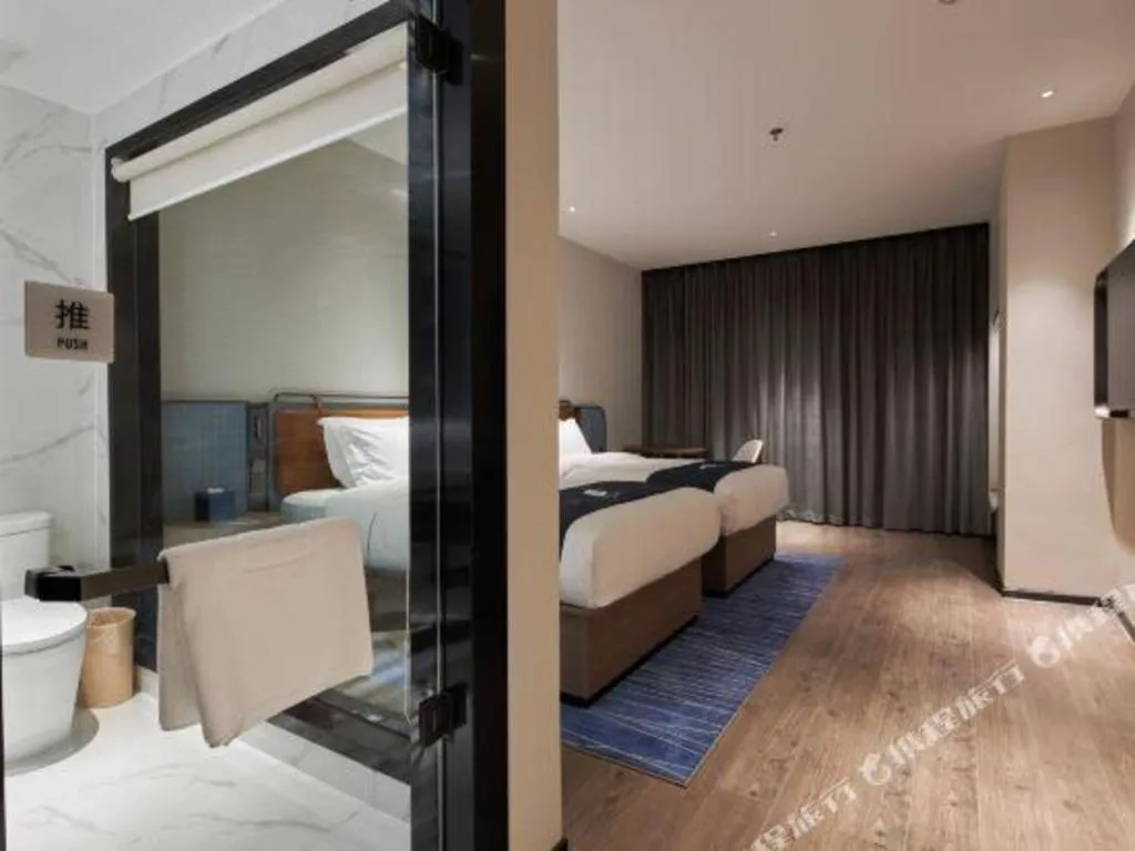 Bed in Echarm Hotel Liuzhou Yaobu Ancient Town