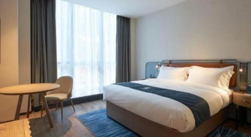 Bed in Echarm Hotel Liuzhou Yaobu Ancient Town