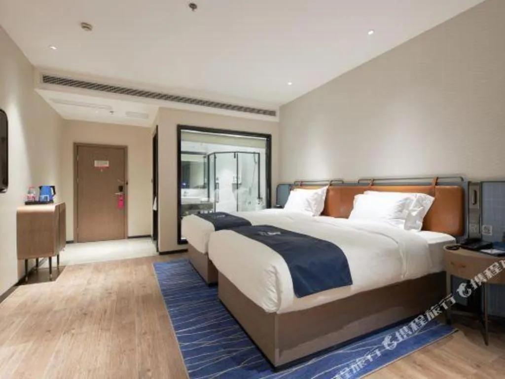 Bed in Echarm Hotel Liuzhou Yaobu Ancient Town