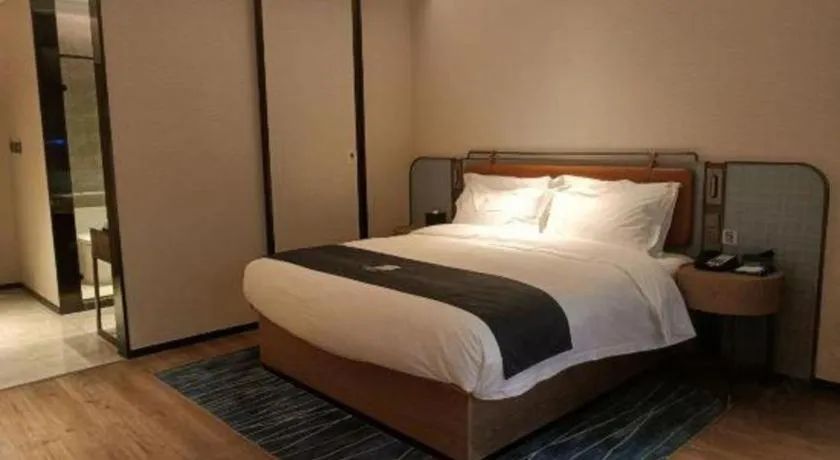 Bed in Echarm Hotel Liuzhou Yaobu Ancient Town