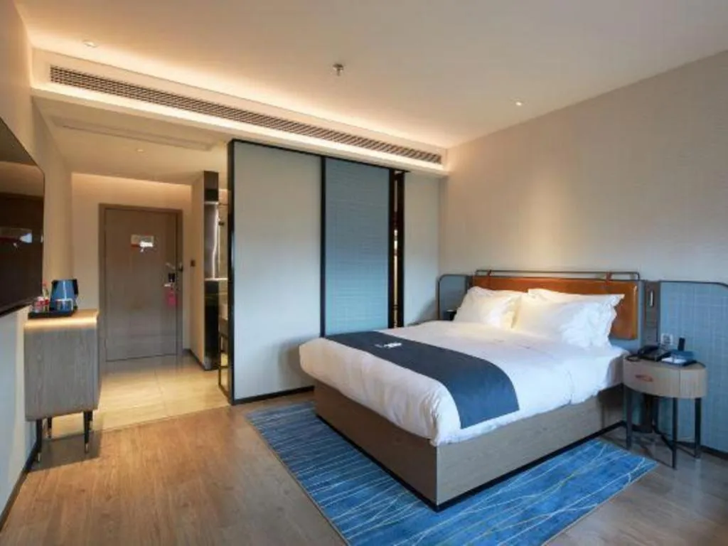 Bed in Echarm Hotel Liuzhou Yaobu Ancient Town