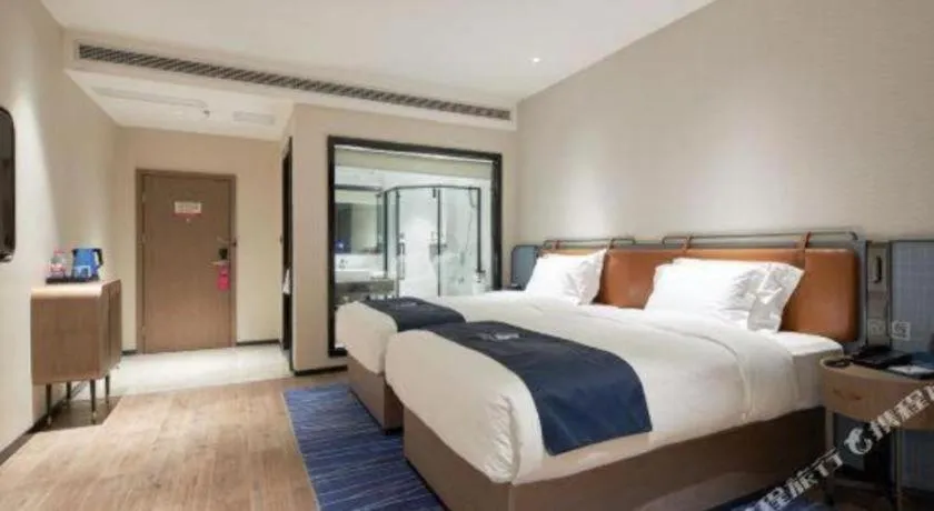 Bed in Echarm Hotel Liuzhou Yaobu Ancient Town