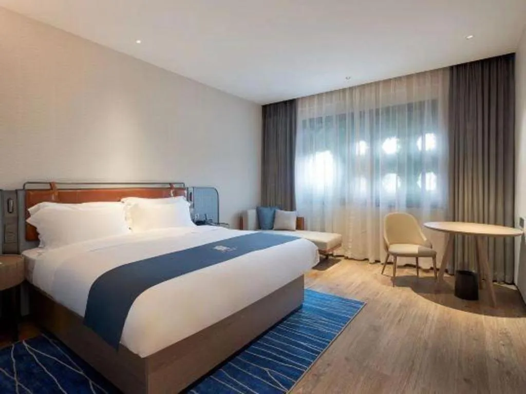 Bed in Echarm Hotel Liuzhou Yaobu Ancient Town