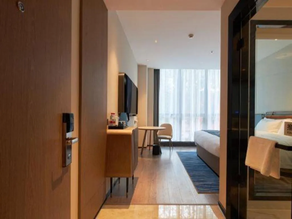 Bed in Echarm Hotel Liuzhou Yaobu Ancient Town