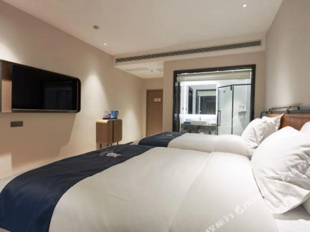 Bed in Echarm Hotel Liuzhou Yaobu Ancient Town