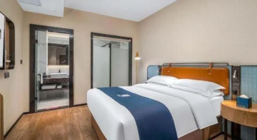 Bed in Echarm Hotel Liuzhou Yaobu Ancient Town