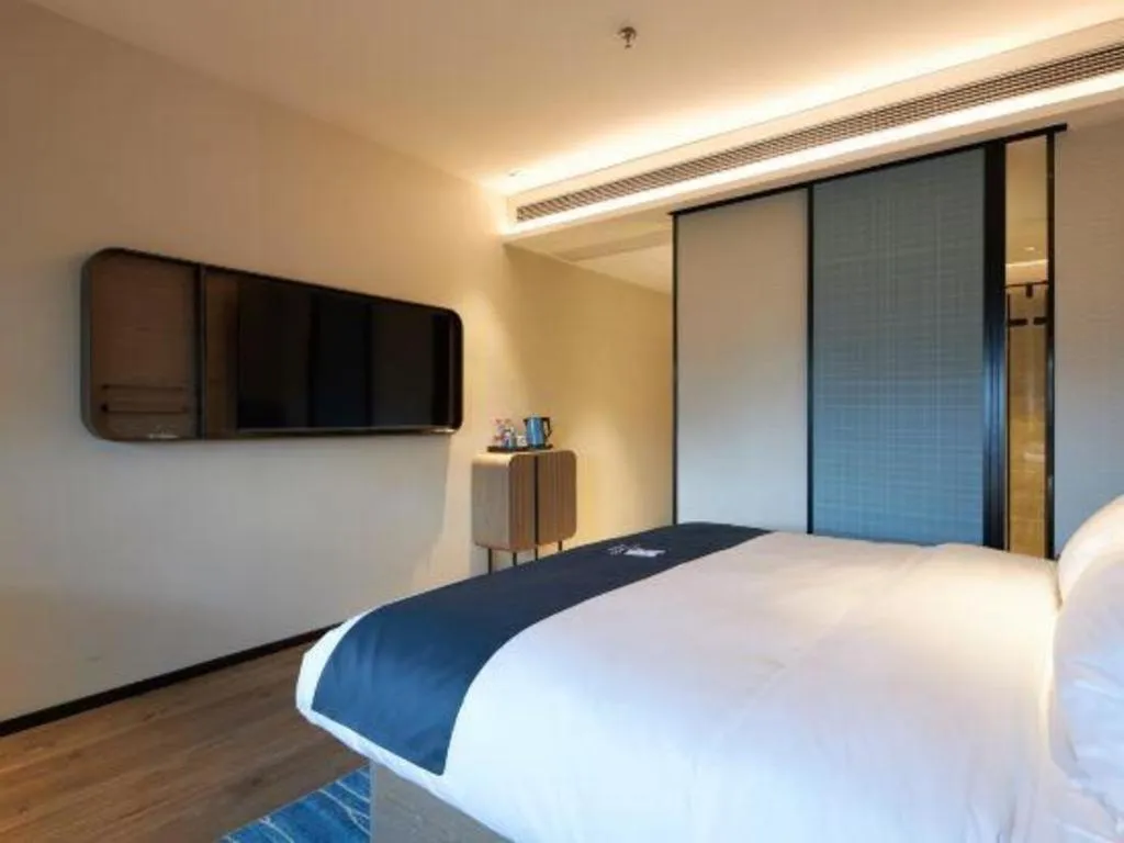 Bed in Echarm Hotel Liuzhou Yaobu Ancient Town