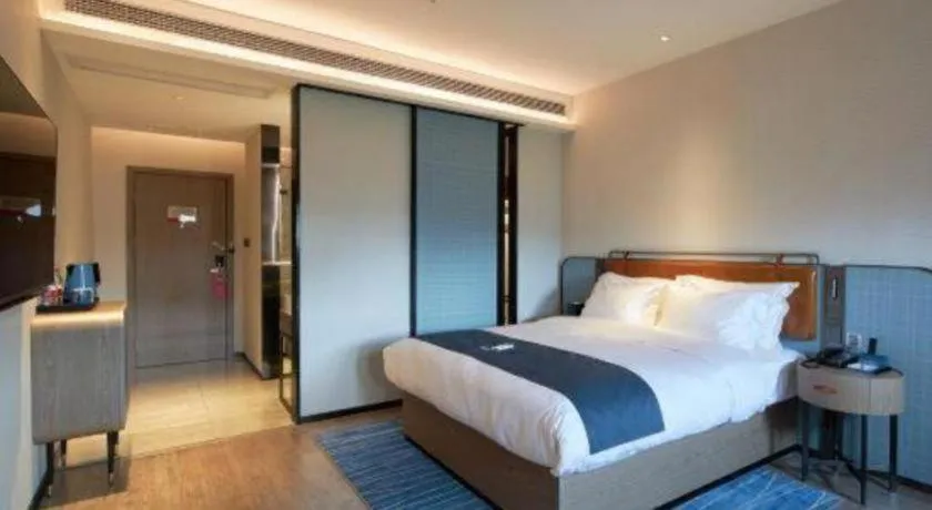 Bed in Echarm Hotel Liuzhou Yaobu Ancient Town