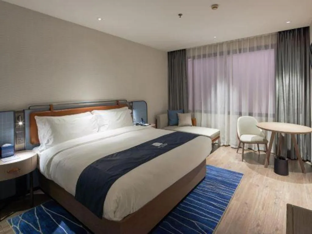 Bed in Echarm Hotel Liuzhou Yaobu Ancient Town