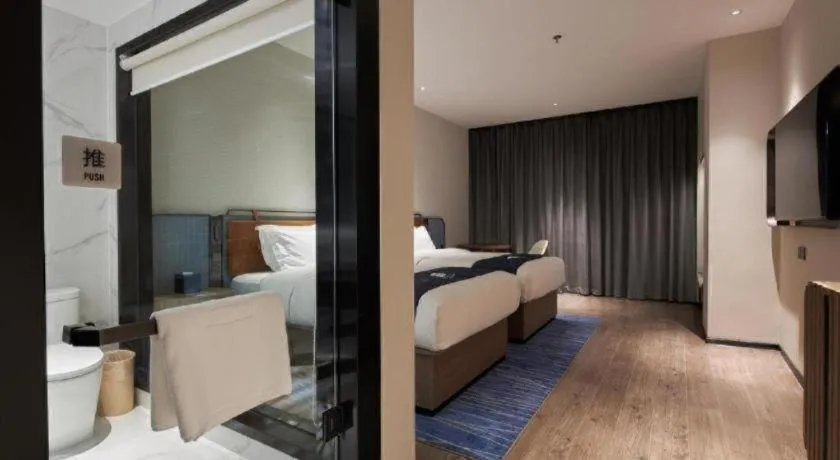 Bed in Echarm Hotel Liuzhou Yaobu Ancient Town