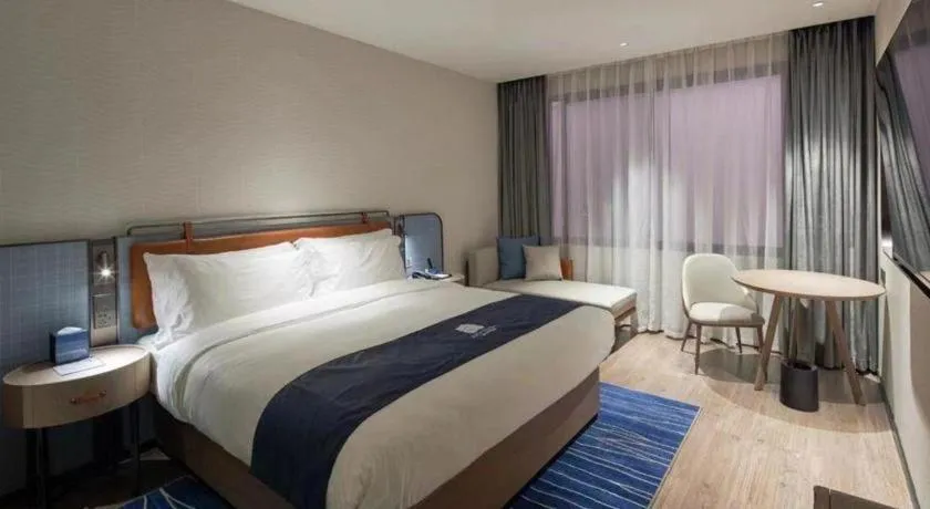 Bed in Echarm Hotel Liuzhou Yaobu Ancient Town