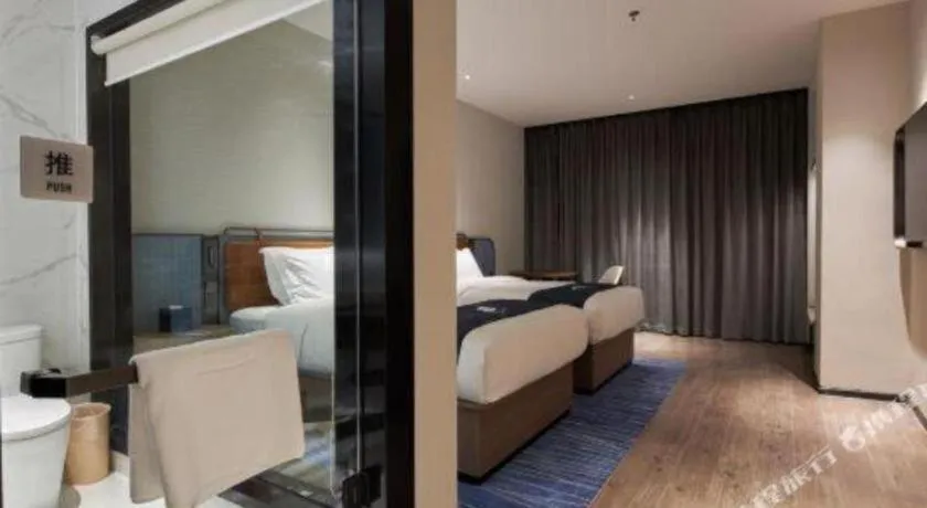 Bed in Echarm Hotel Liuzhou Yaobu Ancient Town