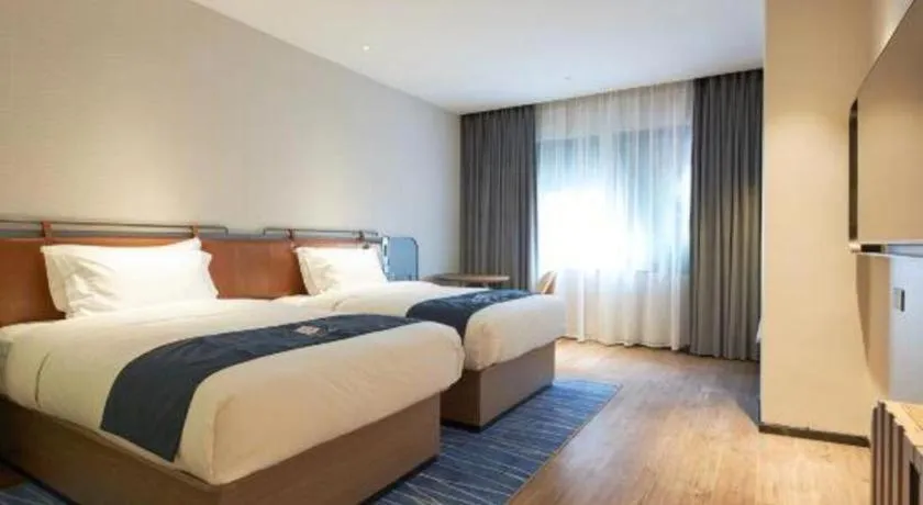 Bed in Echarm Hotel Liuzhou Yaobu Ancient Town