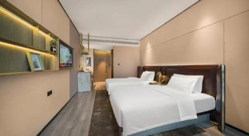 Bed in Premier City Comfort Hotel Quanzhou Wanda Plaza