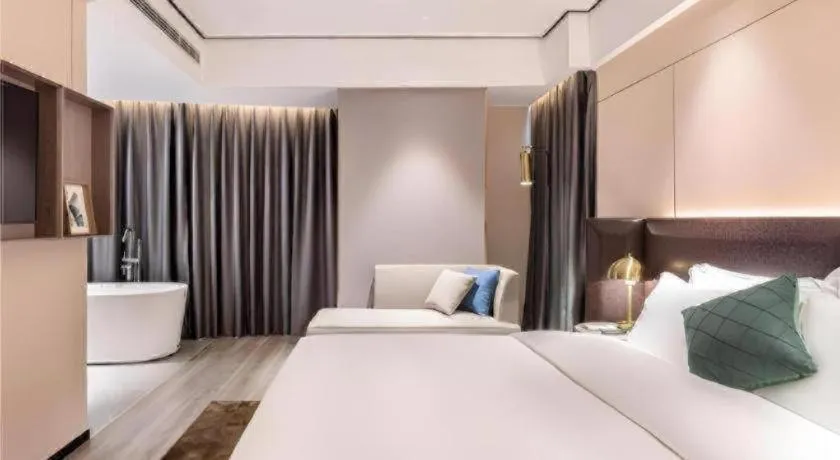 Bed in Premier City Comfort Hotel Quanzhou Wanda Plaza